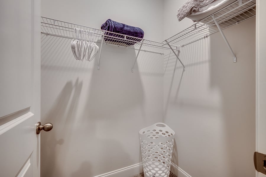 Generous walk-in master closet offering plenty of space for all your stylish wardrobe selections.