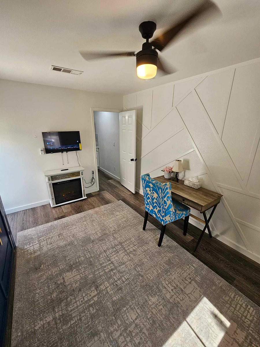 Smart TV, fireplace, custom accent wall, workdesk