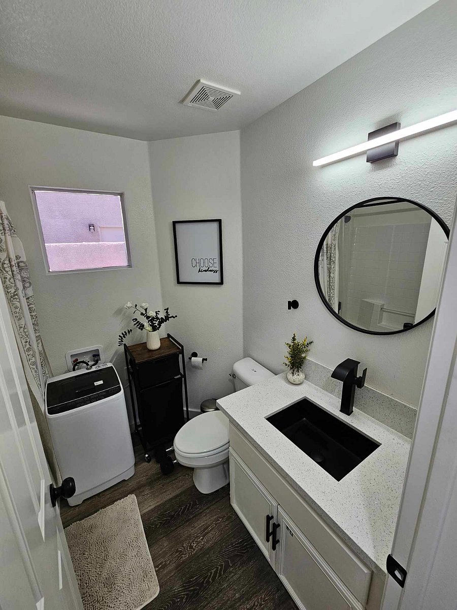 Full size bathroom with mini washer/dryer combo