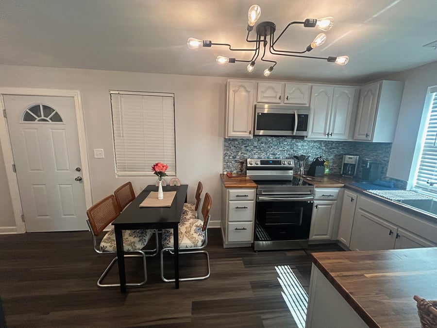 Kitchen with small table and door to garage