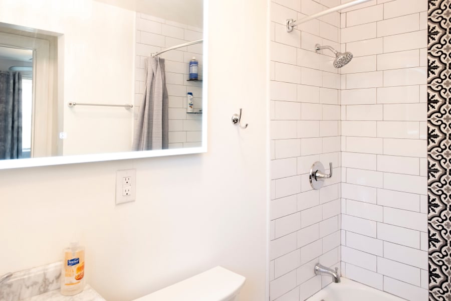 Lighted mirror with bluetooth speakers