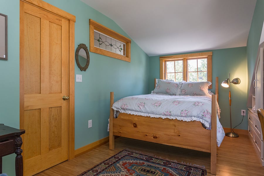 Upstairs guest room with queen bed.