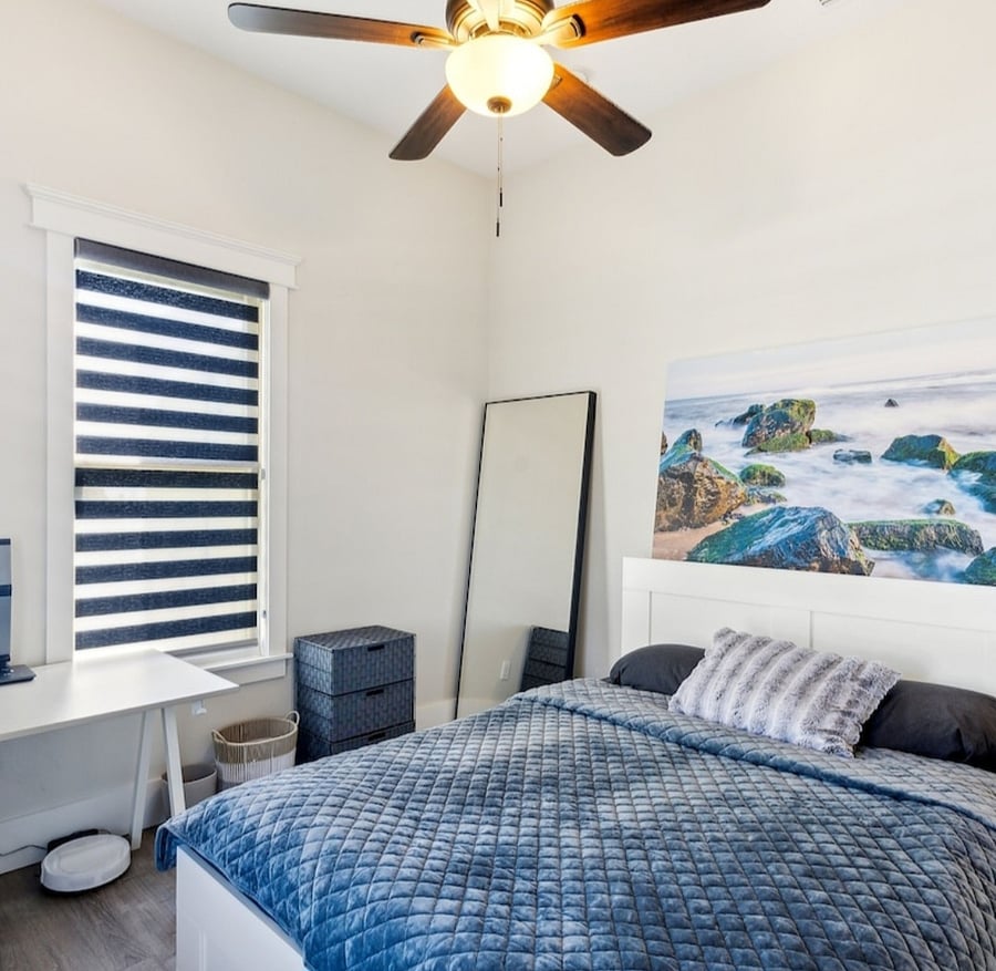 Queen bed has storage drawers. There is shelving in closet. 