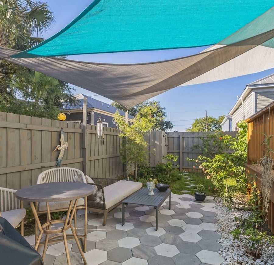 There is a propane grill next to patio. Also an outdoor shower.