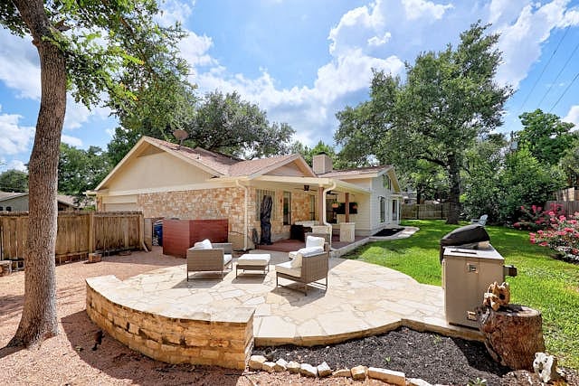 Exterior Patio with Covered Grill Garbage Recepticles