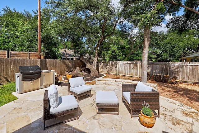 Exterior Back Patio With Covered Grill