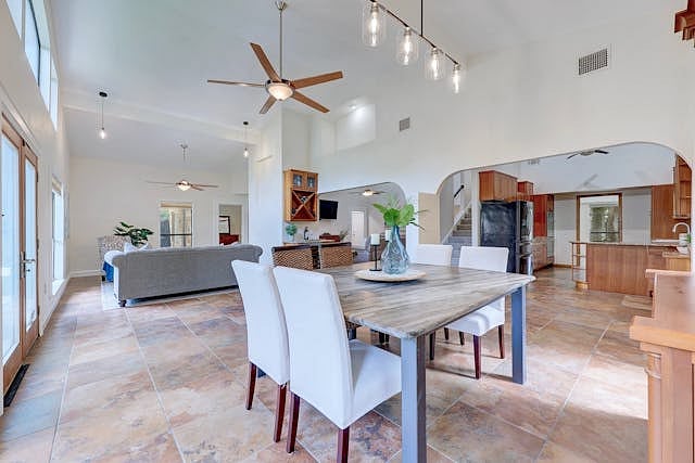 Large Dining Area with Custom Granite Table Adjacent to Second Sitting Aria