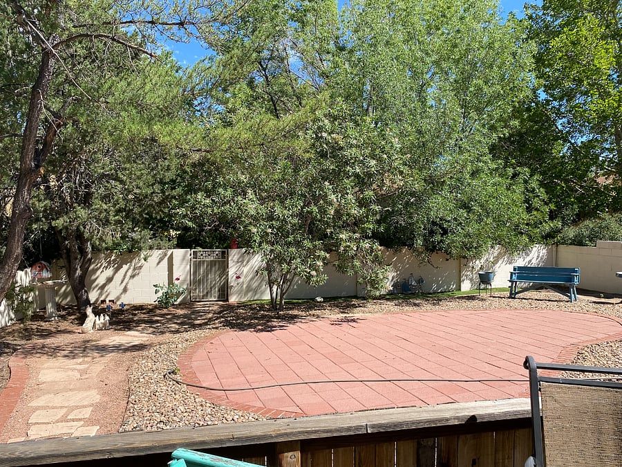 Backyard with gate to paved walking paths