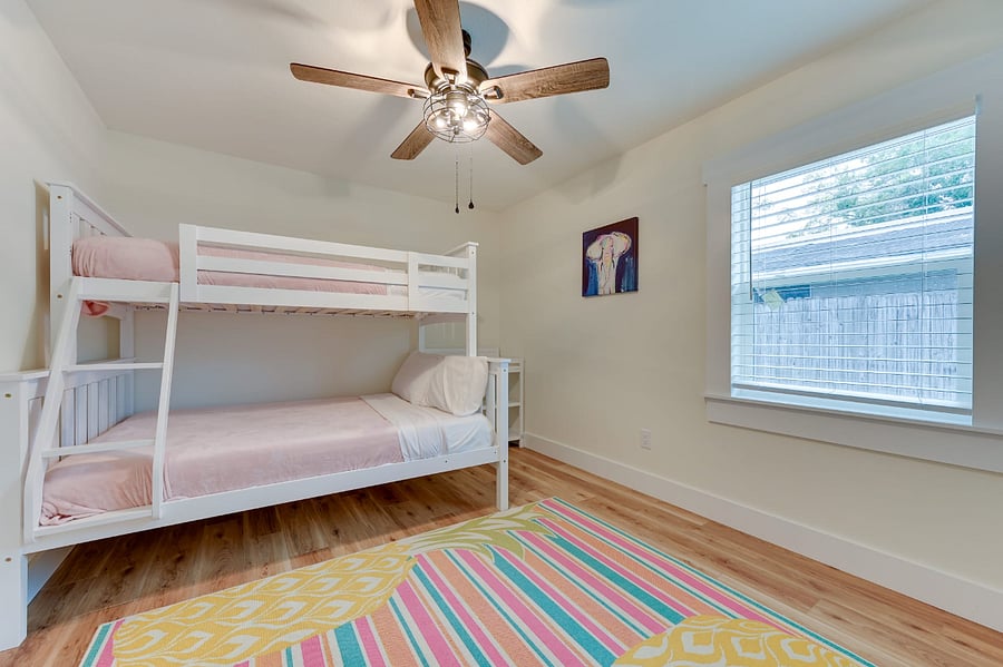 Secondary bedroom with twin over full bunk, changing station for babies