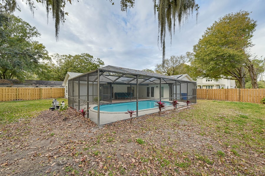 Full fenced backyard with enclosed pool