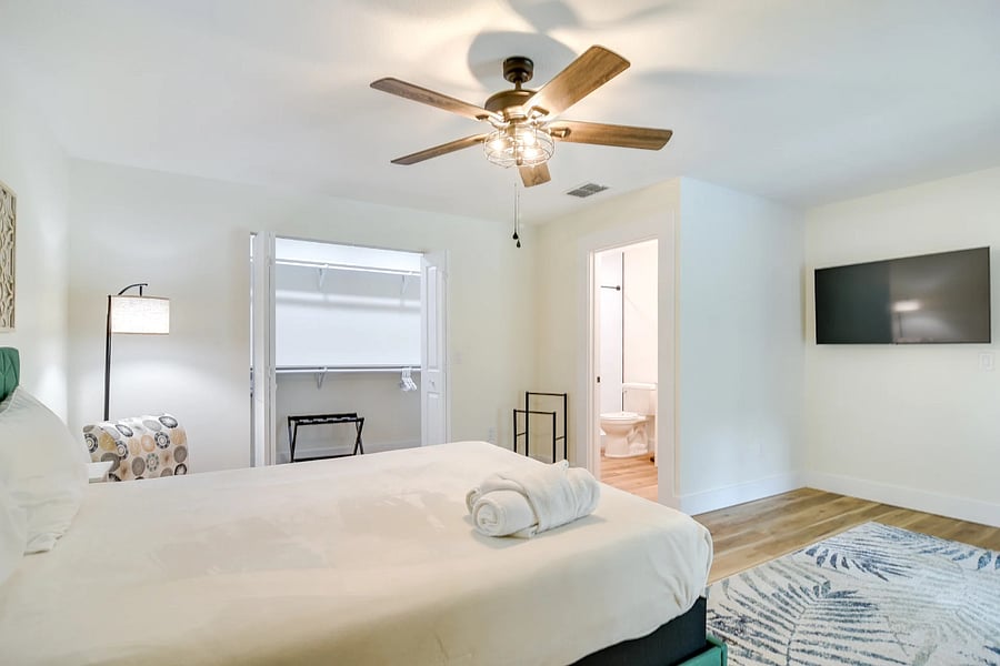 Primary bedroom, queen bed with ensuite opens to enclosed pool patio