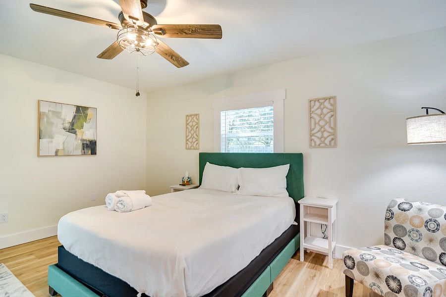 Primary bedroom, queen bed with ensuite opens to enclosed pool patio
