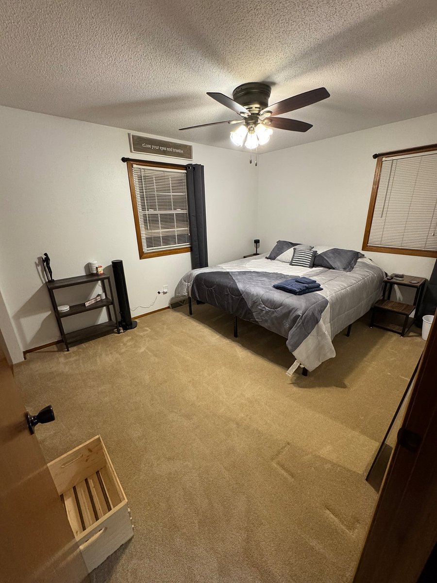 Master bedroom with a king bed