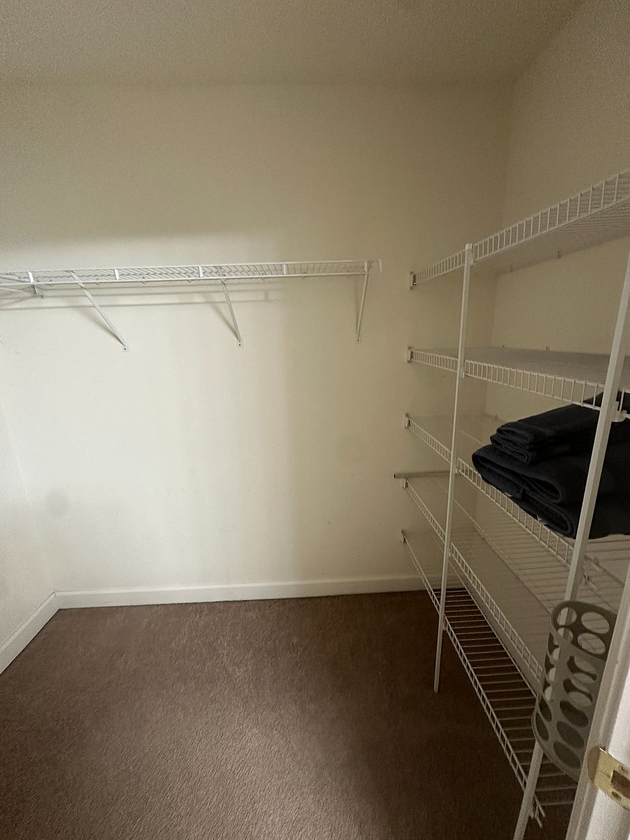 Extra large walk in closet with shelf space