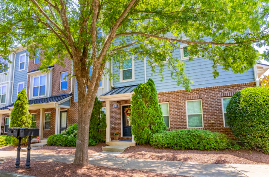 Front door with easy access to street and rear home parking space.