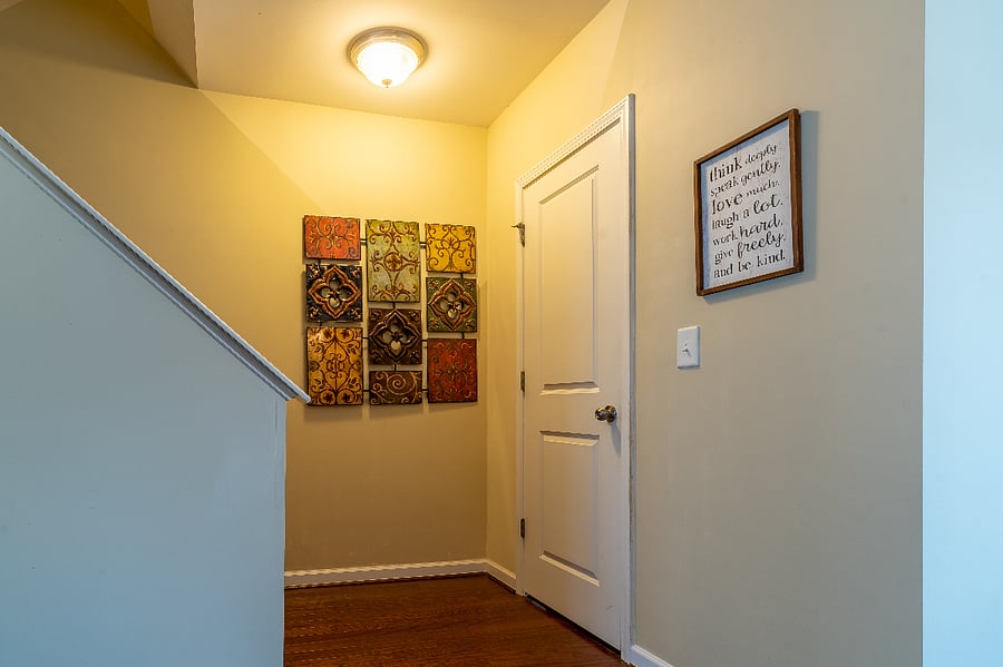 Door to second level half bath.