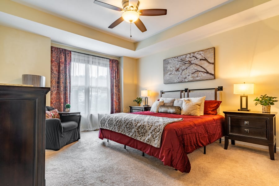 Master bedroom with a king size bed located on the third level.