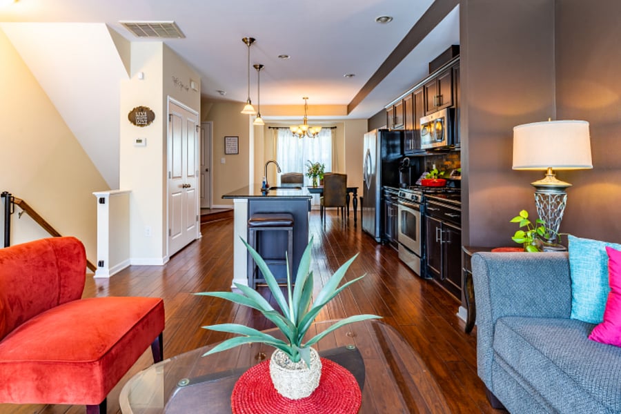 Open concept kitchen, living and dining area on second level.