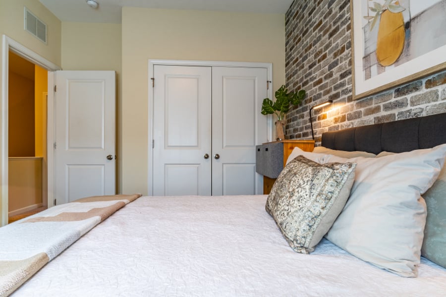Secondary bedroom with view of double door closet space located on the third level.