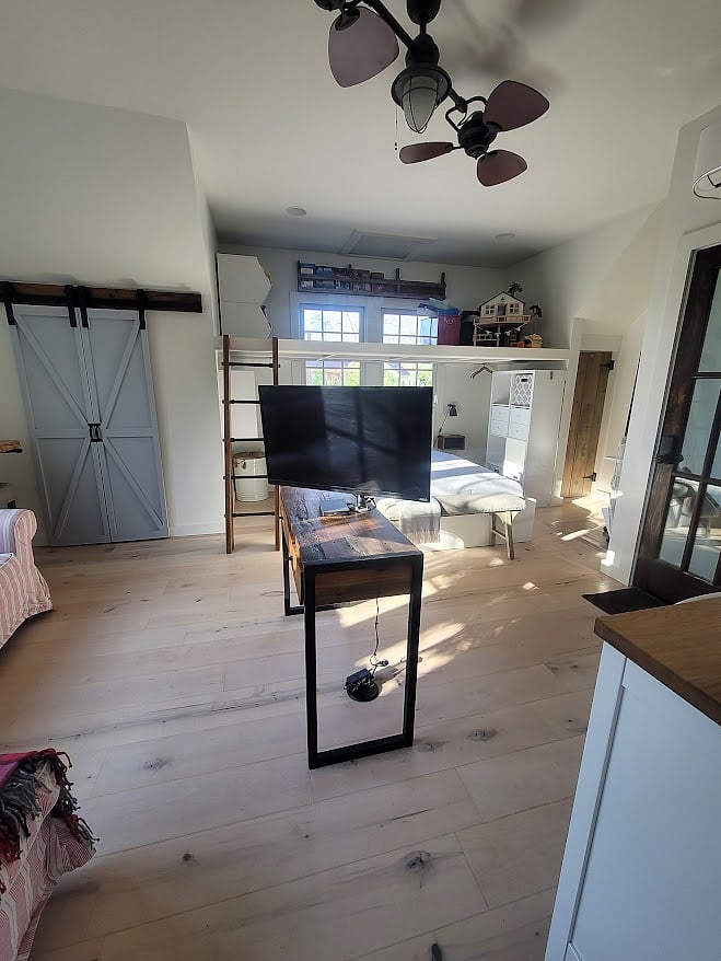 TV on swivel to view from Kitchen, Living Room, and Bedroom