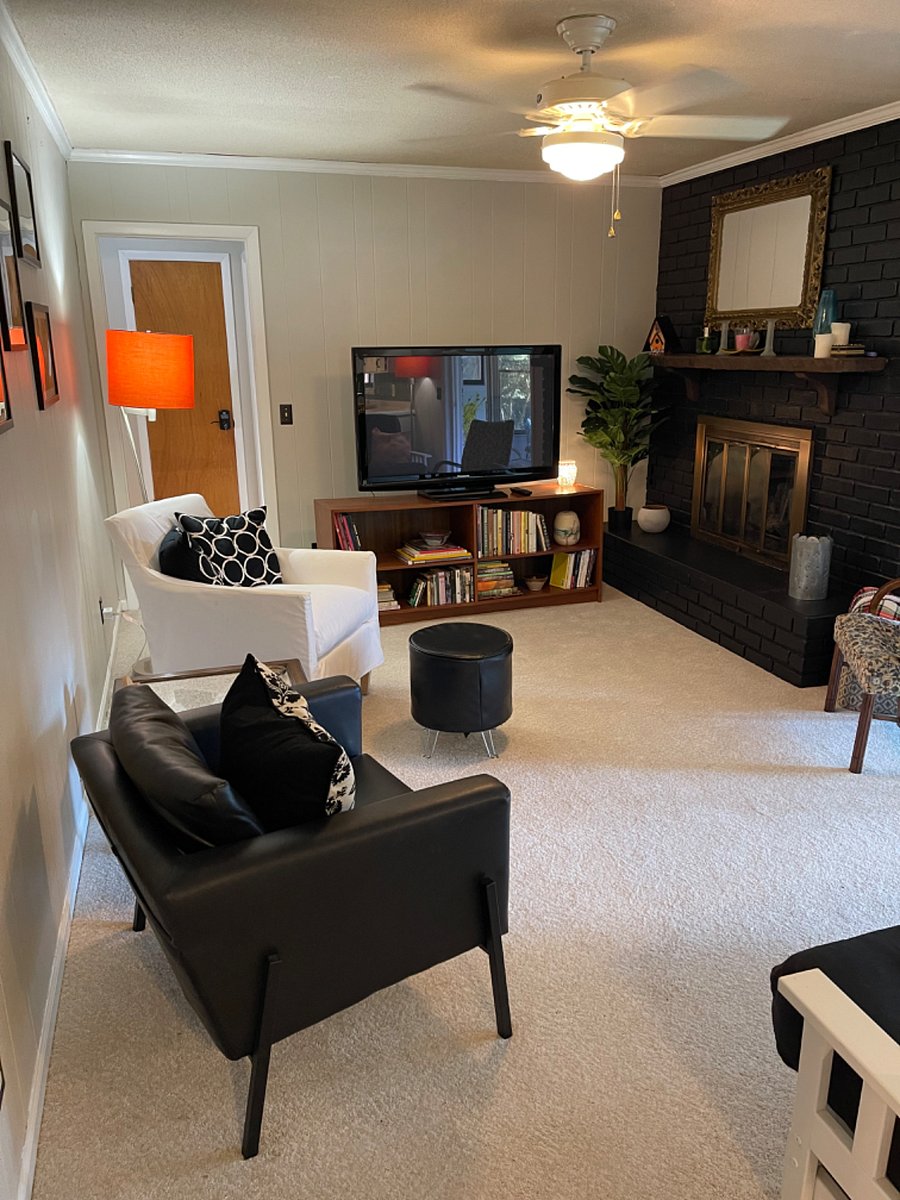 Cozy, comfortable Den just off of Kitchen. Offers a gorgeous view of the backyard through the Sun Room.