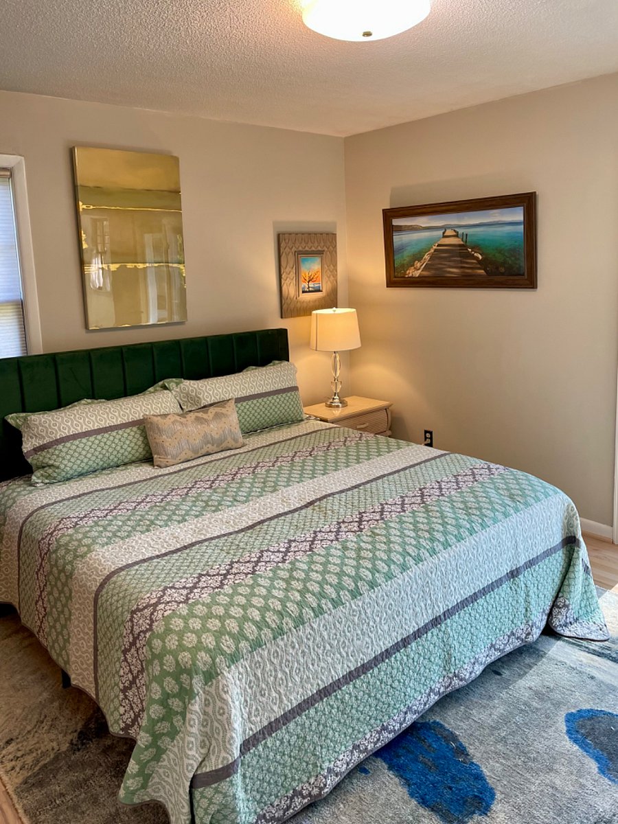 Enjoy a luxurious night and restful sleep in the Primary Bedroom with king size bed, and en suite bathroom. Wake up and greet the day on the Deck, conveniently adjacent through sliding glass doors. Great for morning coffee. 