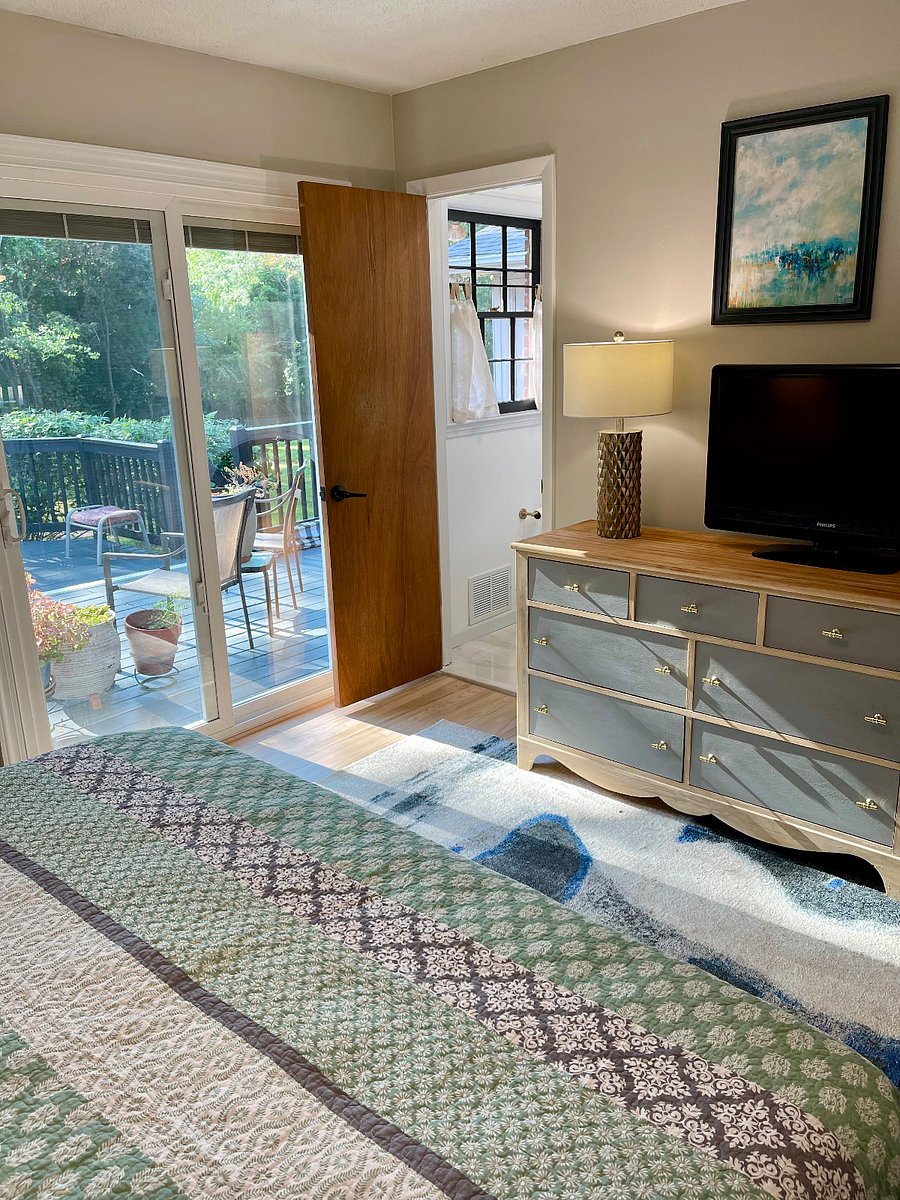 The newly renovated Primary Bedroom offers the peace and tranquility you deserve. Step through the glass doors onto the Deck, and listen to the morning birdsong while you relax and sip your coffee in one of our guest spa robes.