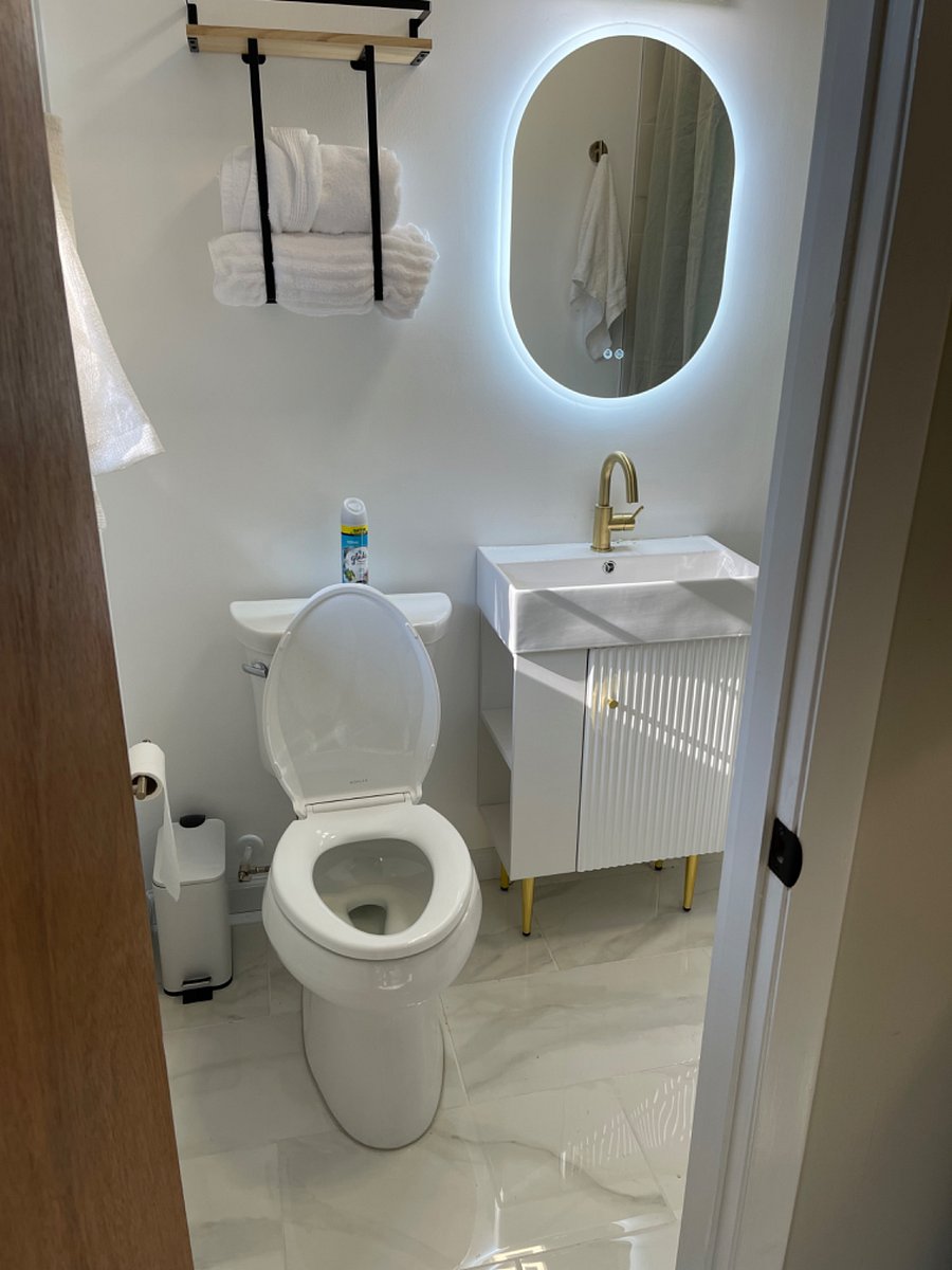 Hello gorgeous! Defog the smart mirror, or adjust the lighting for maximum effect, as you get ready in one of our luxurious spa robes in the Primary Bedroom en suite Bathroom. Play your favorite mix on the blue tooth speaker in the newly renovated shower.