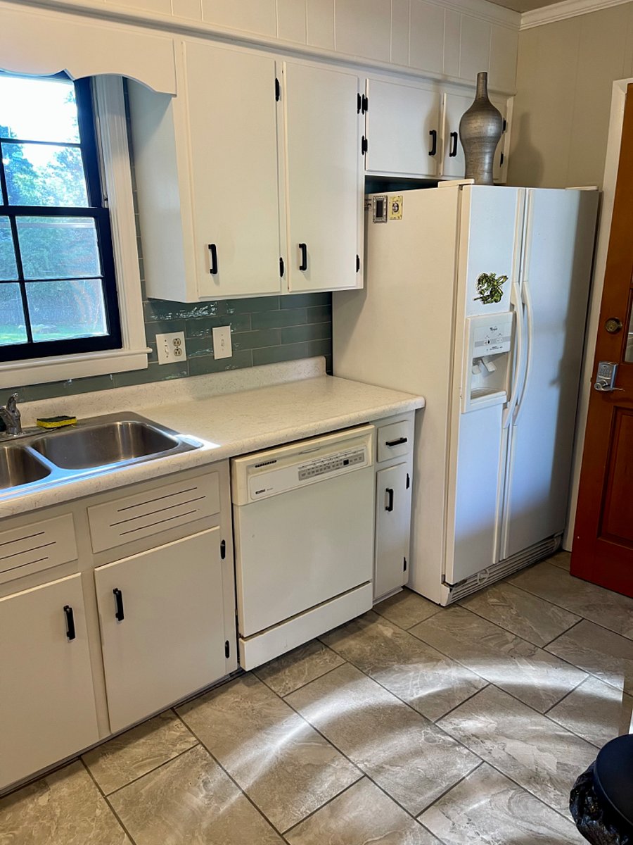 Make yourself comfortable in the fully loaded Kitchen as you survey the peaceful back yard.
