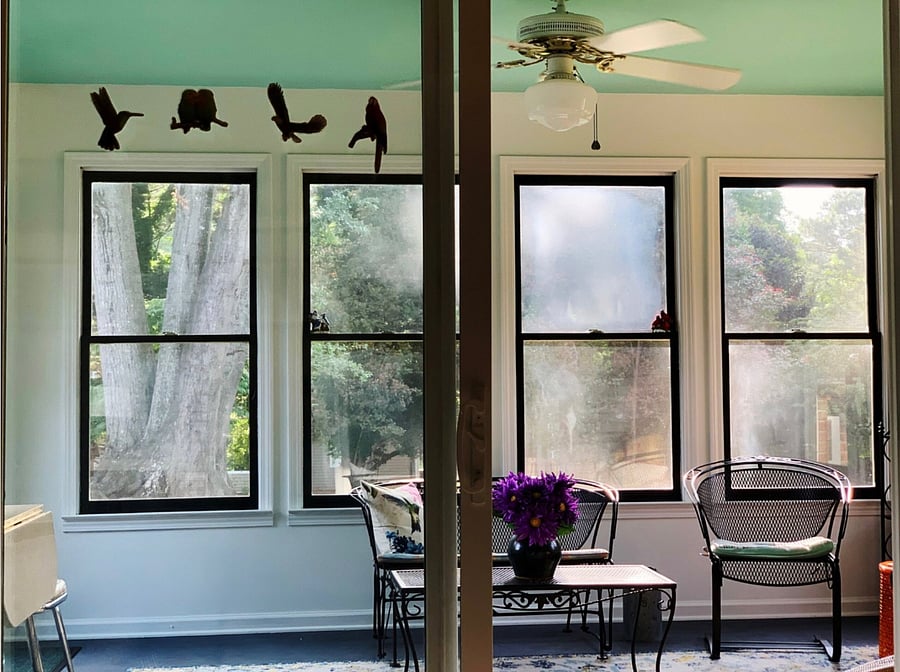 The welcoming view to the Sunroom from the Den. Relax, and let the sun shine in. 