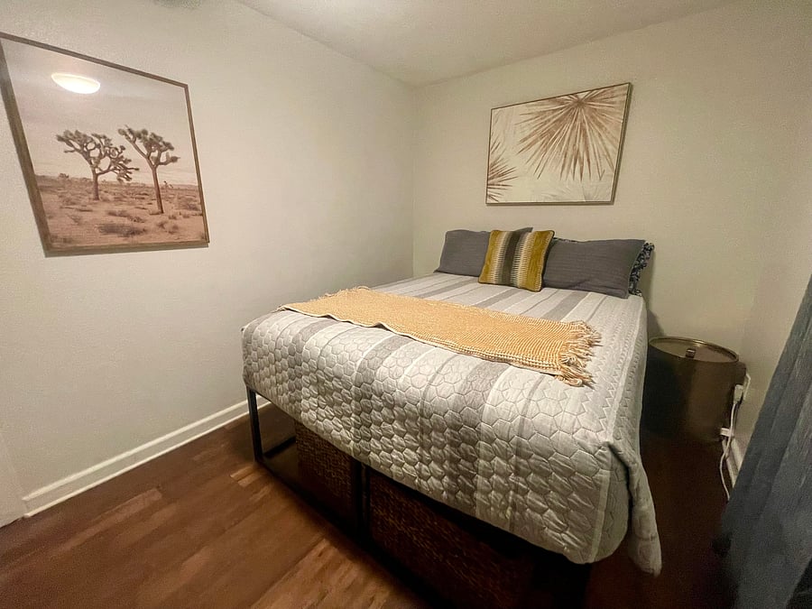 This is bedroom two - with a queen size bed and two side tables.