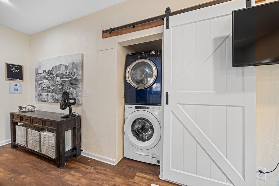 Laundry area with full size front loading washer and dryer