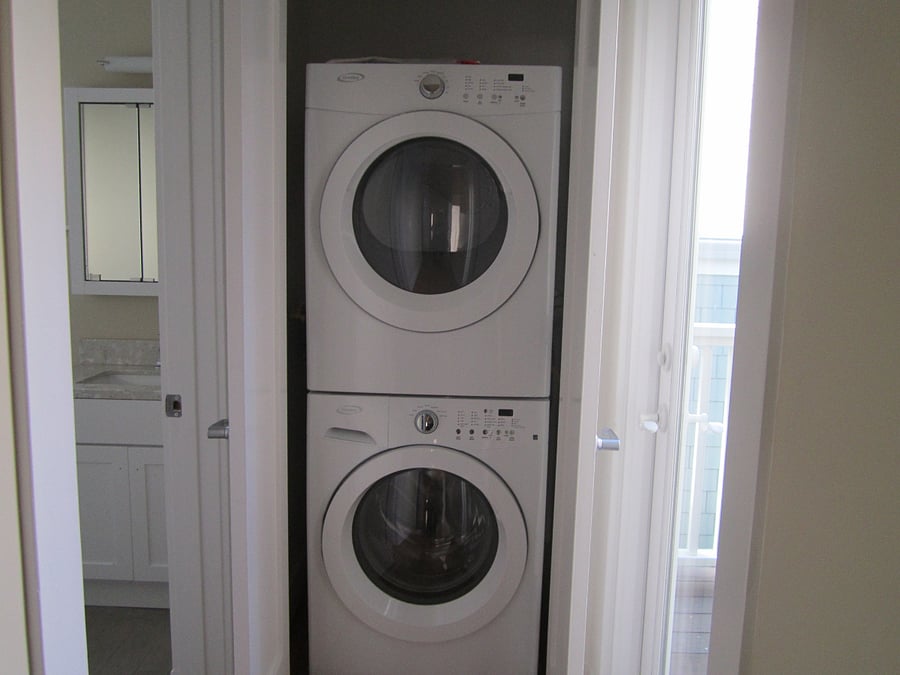 In unit laundry.  Your bathroom is to the left, deck to the right.