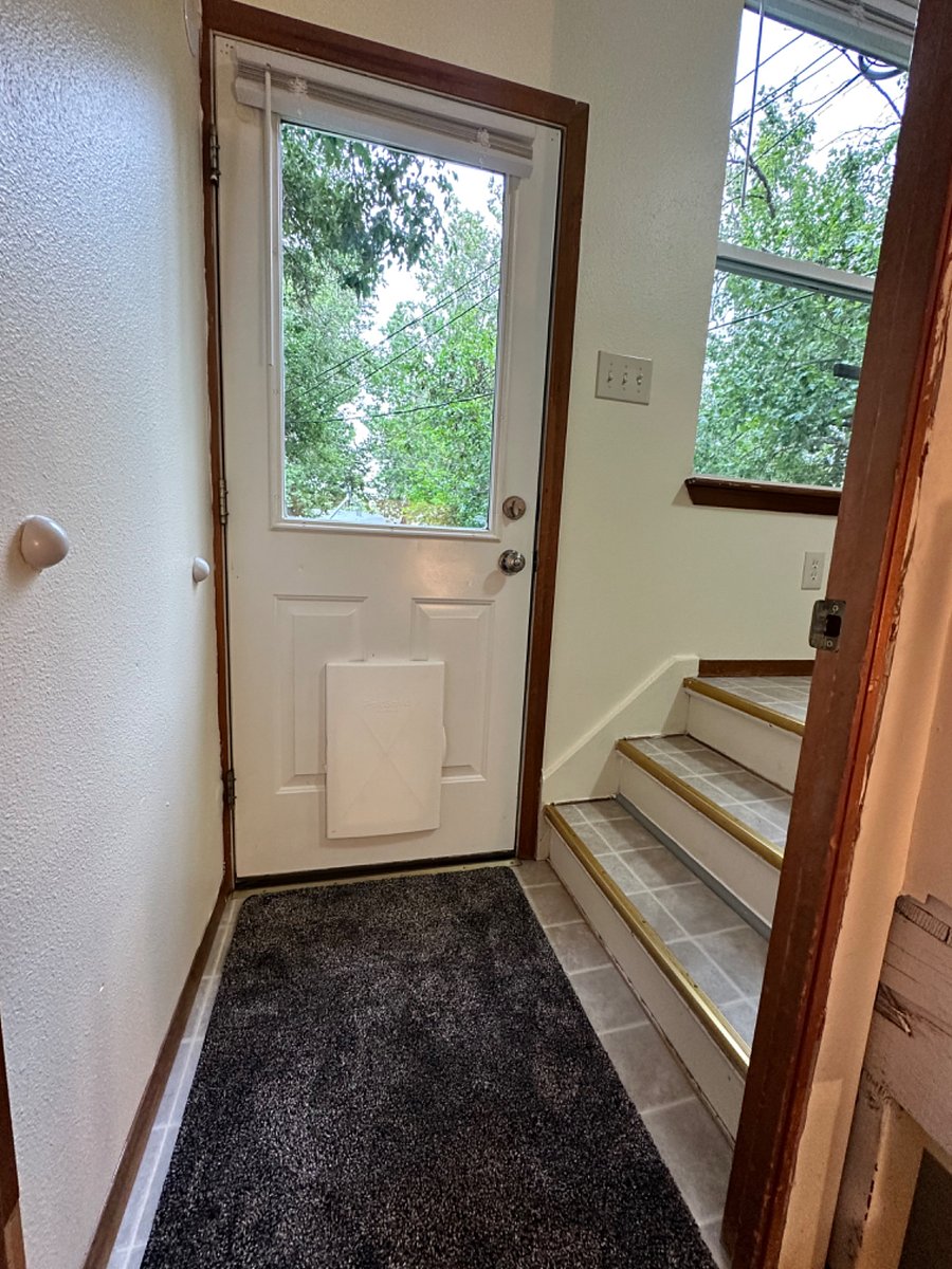 Door to the fully fenced back yard.