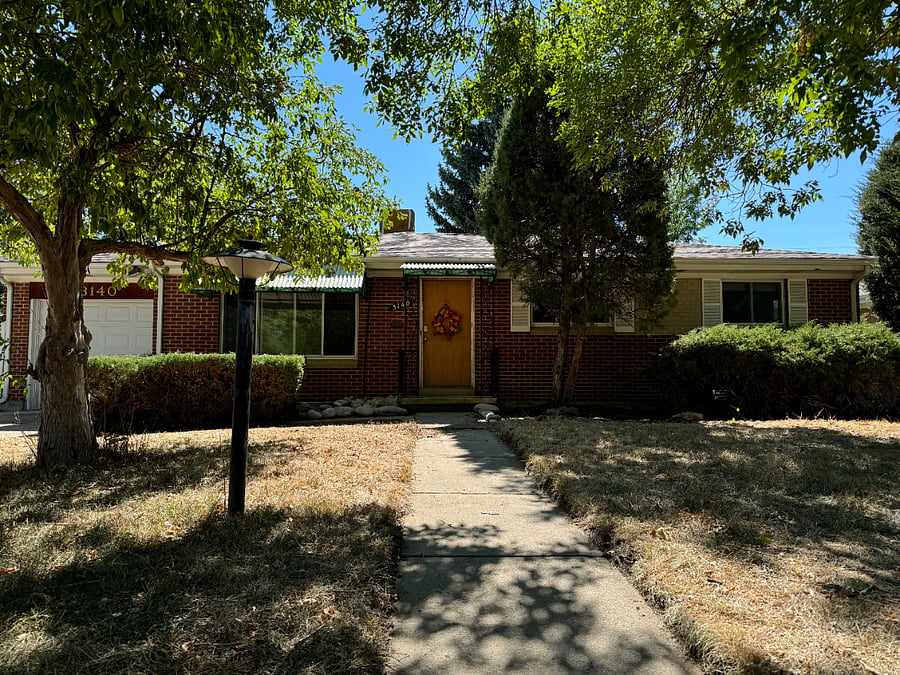 You will enter through the garage on the left side of the house.