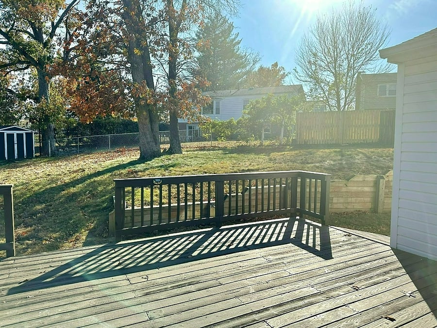 large deck overlooking fenced backyard