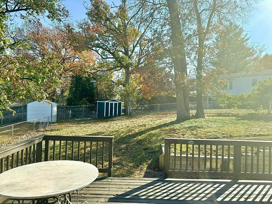 large deck overlooking fenced backyard