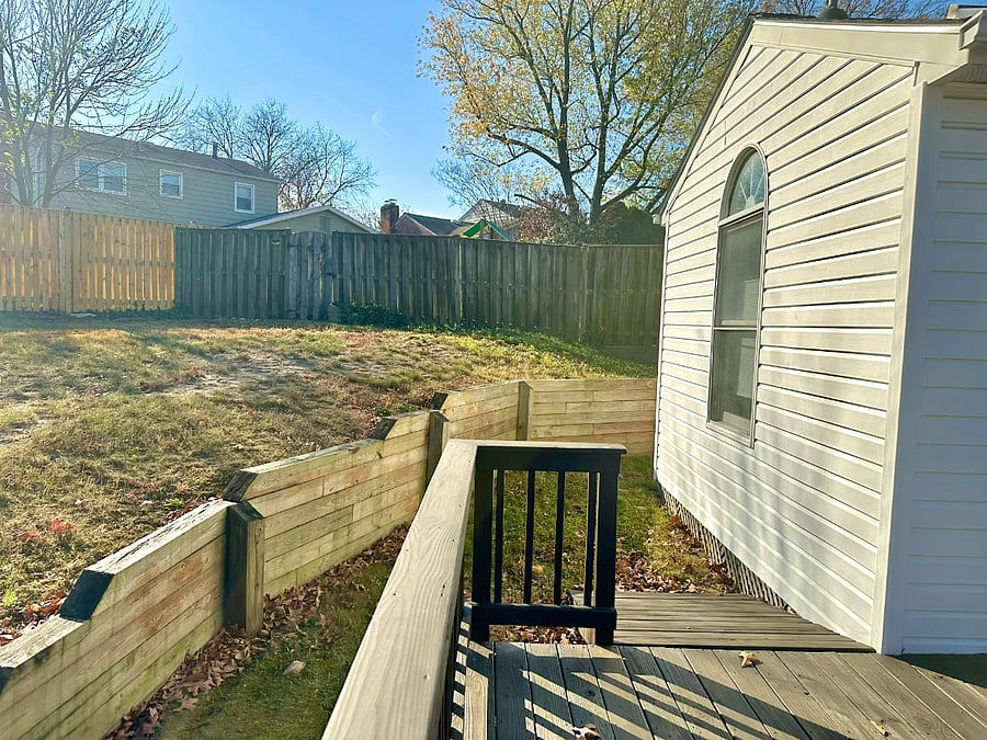 large deck overlooking fenced backyard