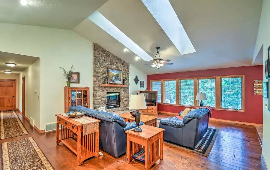 Spacious living room with a view of the backyard.