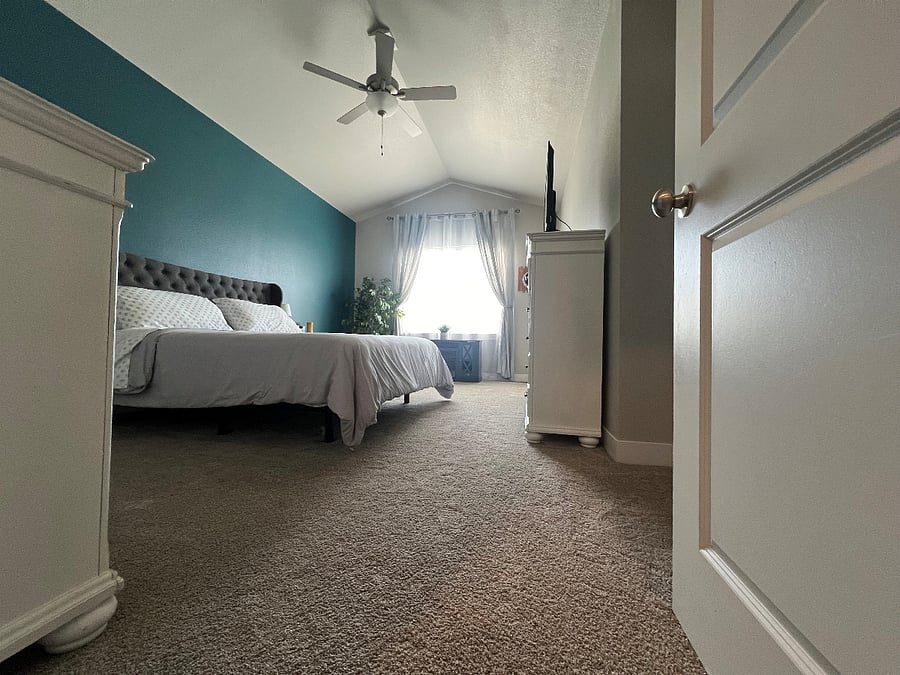 Primary bedroom with en-suite bathroom and closet