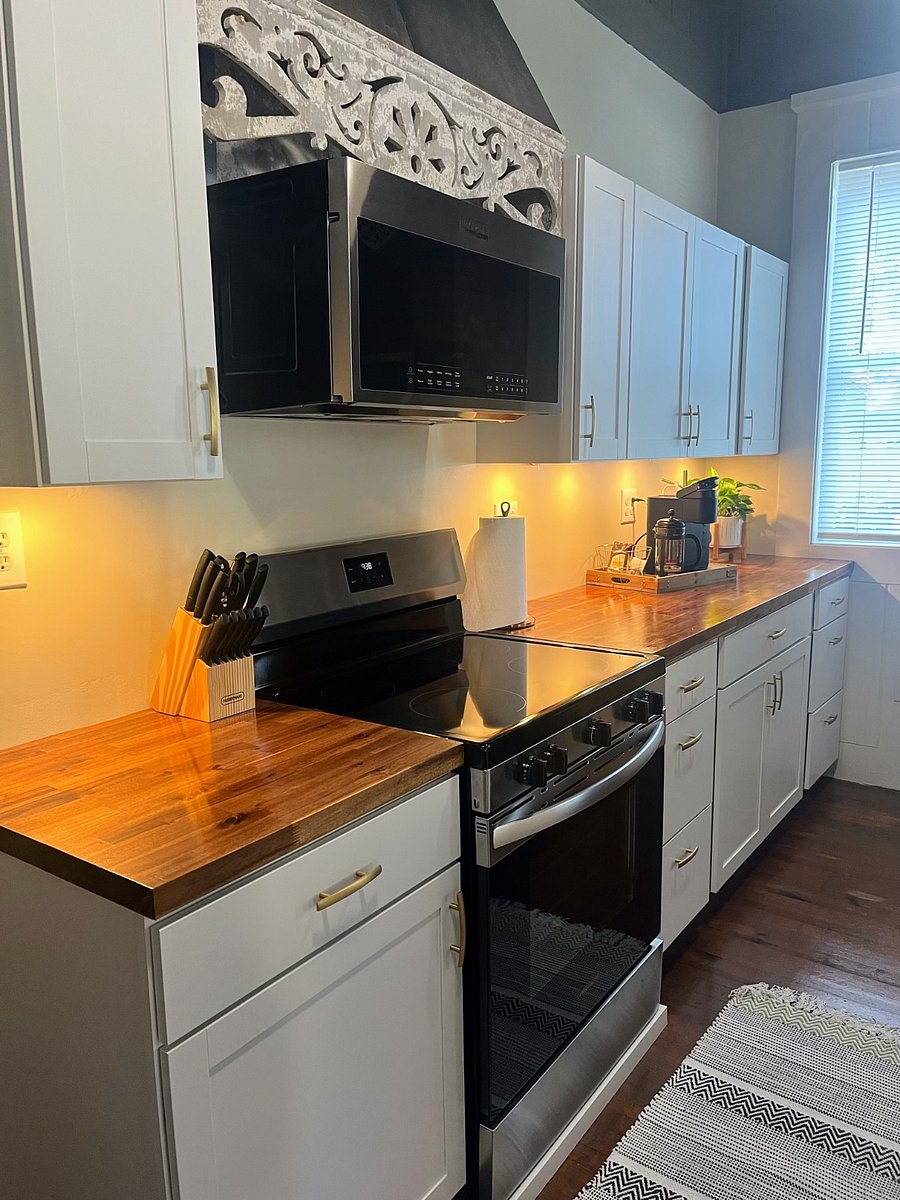 Cooking area with full size microwave, Keurig coffee maker, French Press, 12 cup coffee maker