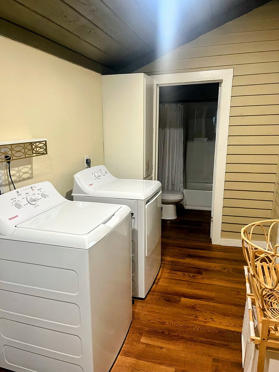 View from laundry area into the small bathroom