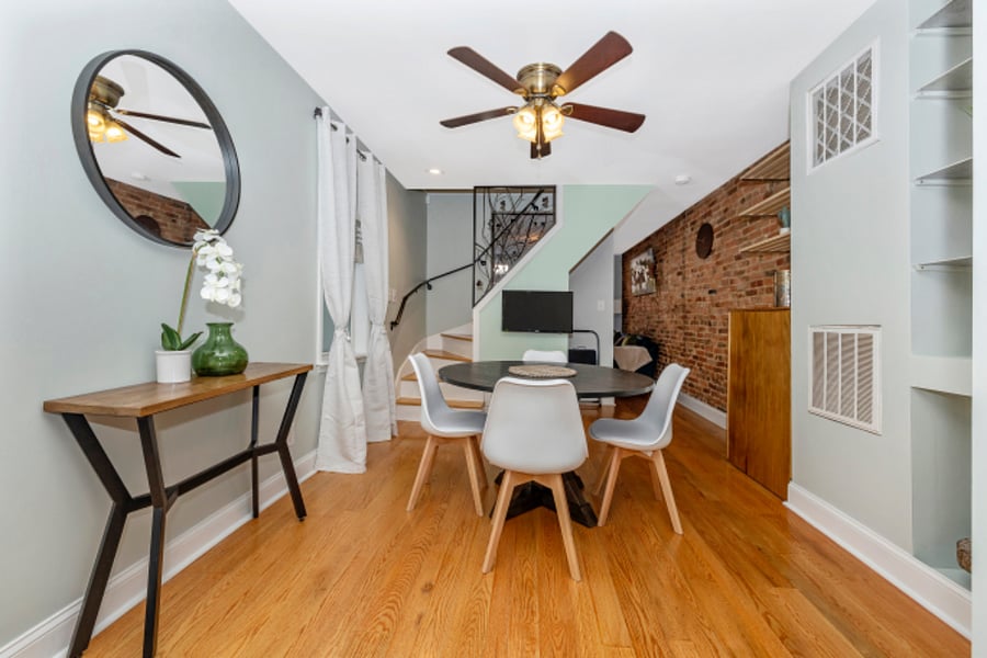 Dining nook with table for 4, TV with Roku & ceiling fan.