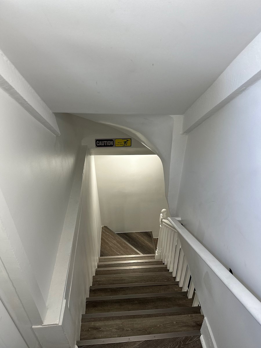top of stairs once you enter unit