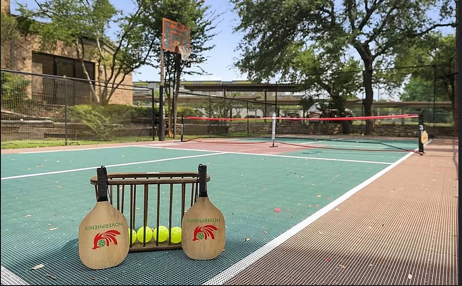 Pickleball/basketball court on property
