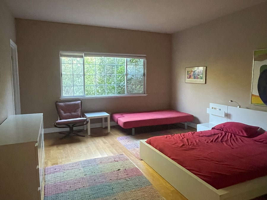Bedroom with full bed and twin futon bed
