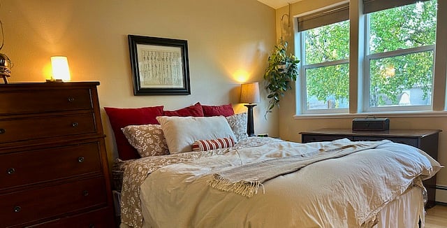Bedroom with door to back patio and garden.