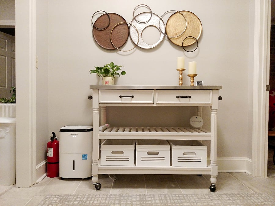 Table gives additional space for printer or working and storage. The bins under the shelf are good for storing dry goods.