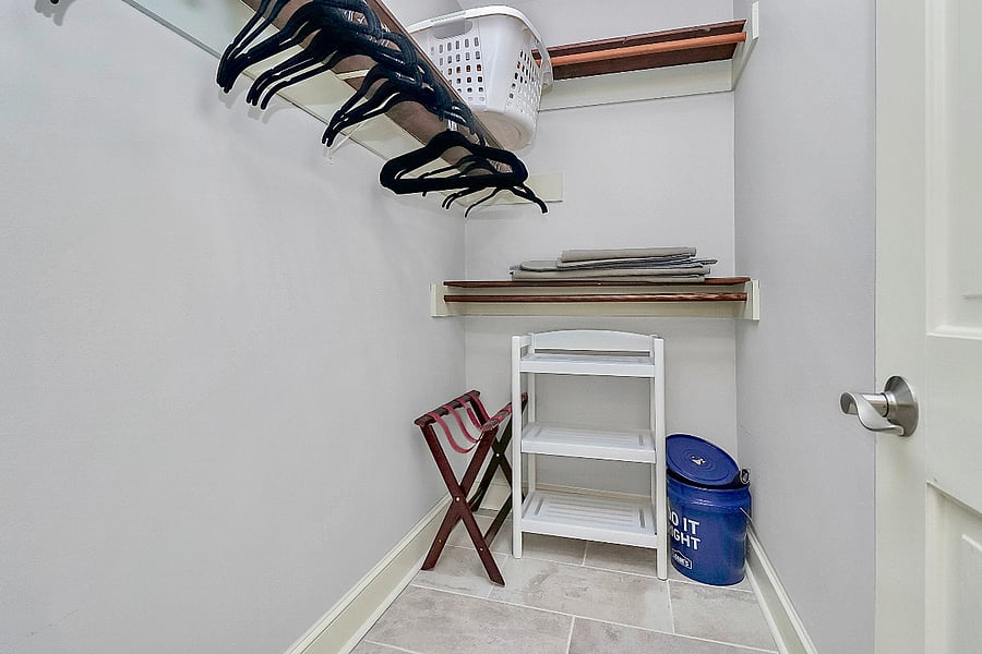 Walk-in closet for the brick bedroom with Full size bed