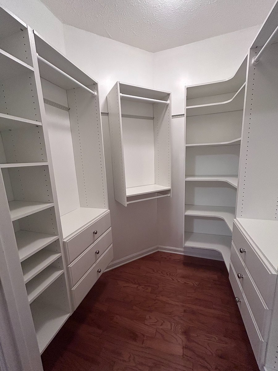Custom walk in closet in primary downstairs bedroom